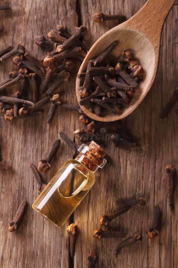 Essence of Cloves in the Bottle Macro Horizontal Top View Stock Photo
