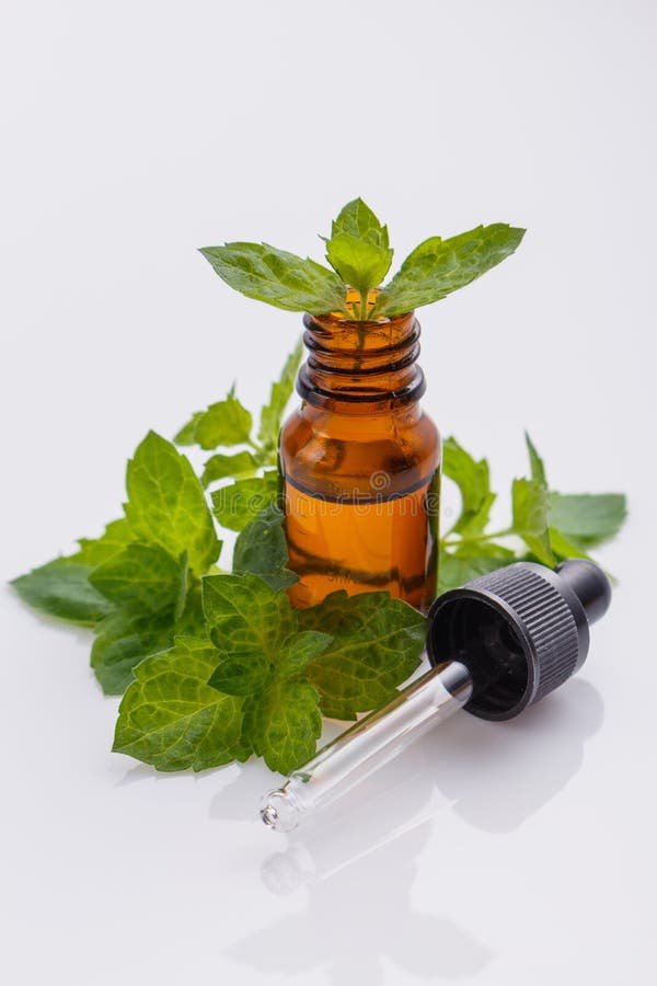 Essential oil of peppermint on a white background
