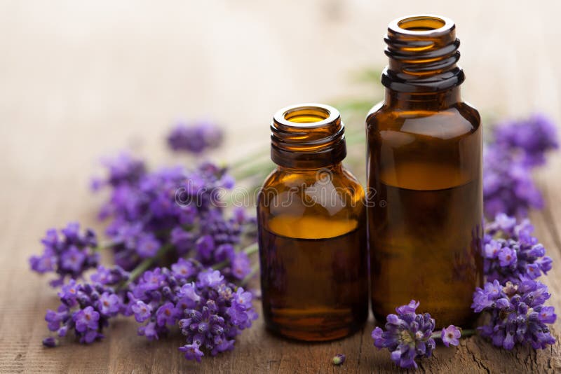 Essential oil and fresh lavender flowers. Essential oil and fresh lavender flowers