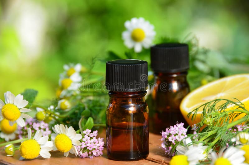 Essential oils with herbal flower and leaves. Essential oils with herbal flower and leaves