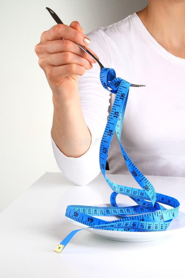 Image of measuring tape with fork and woman. Image of measuring tape with fork and woman
