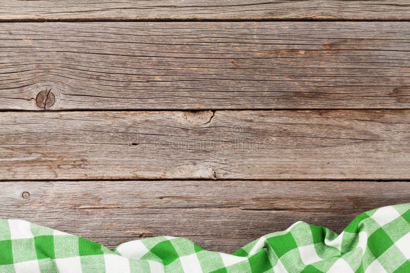 Kitchen towel on wooden cooking table. Top view with copy space. Kitchen towel on wooden cooking table. Top view with copy space