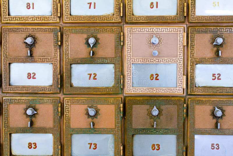 This p.o. box (or post office mail box) has been replaced and is shiny compared to the surrounding boxes. It has the number 62. This p.o. box (or post office mail box) has been replaced and is shiny compared to the surrounding boxes. It has the number 62.