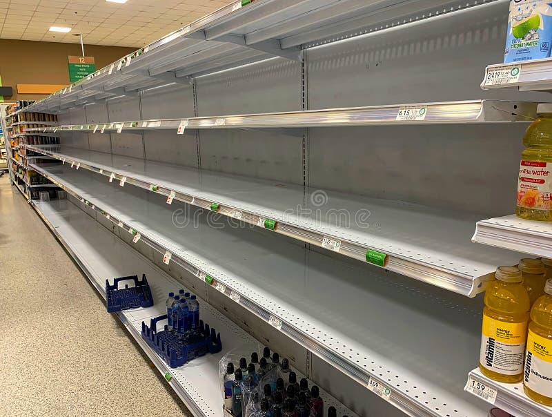 FORT LAUDERDALE, FLORIDA, USA - AUGUST 29, 2019:  Empty water aisle at a local supermarket days before Hurricane Dorian`s expected landfall, as a category 4 storm arrives in Florida. FORT LAUDERDALE, FLORIDA, USA - AUGUST 29, 2019:  Empty water aisle at a local supermarket days before Hurricane Dorian`s expected landfall, as a category 4 storm arrives in Florida.