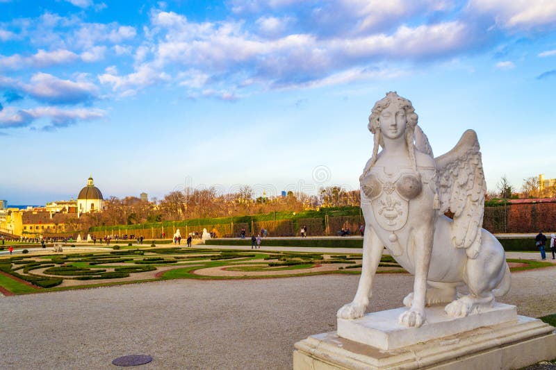 sphinx statue sited in the formal gardens of the Schloss Belvedere palace,Extensive mythological references throughout the gardens allude to the rise of Prince Eugene with a sculptural program linking him to the god Apollo.A great water basin in the upper parterre and the stairs and cascades peopled by nymphs and goddesses that links upper and lower parterres survive,The Belvedere Gardens were designed in the formal French manner with clipped hedges, gravelled walks.December 21th 2014. sphinx statue sited in the formal gardens of the Schloss Belvedere palace,Extensive mythological references throughout the gardens allude to the rise of Prince Eugene with a sculptural program linking him to the god Apollo.A great water basin in the upper parterre and the stairs and cascades peopled by nymphs and goddesses that links upper and lower parterres survive,The Belvedere Gardens were designed in the formal French manner with clipped hedges, gravelled walks.December 21th 2014