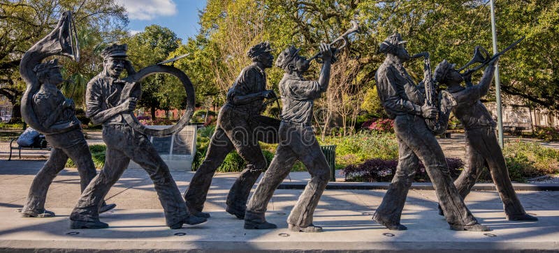 New Orleans, United States: Febraury 27, 2020: Statue of Jazz Band Marches Along Louis Armstrong park. New Orleans, United States: Febraury 27, 2020: Statue of Jazz Band Marches Along Louis Armstrong park