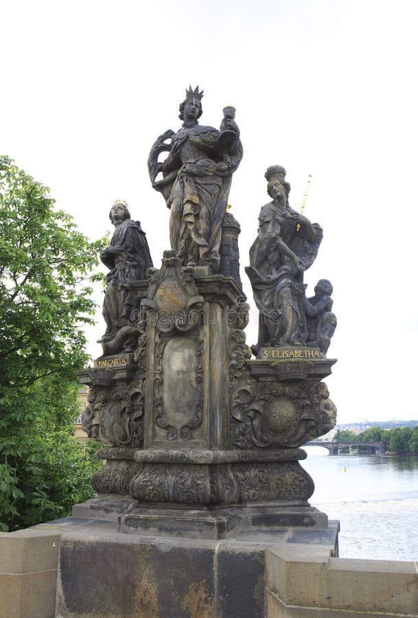 Statues of saints Barbara, Margaret and Elizabeth. Charles Bridge in Prague. Czech Republic. Statues of saints Barbara, Margaret and Elizabeth. Charles Bridge in Prague. Czech Republic.
