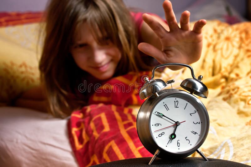 Estela perezosa del sueño de la cama del reloj del sitio imagen de archivo Estela perezosa del sueño de la cama del reloj del sitio imagen de archivo