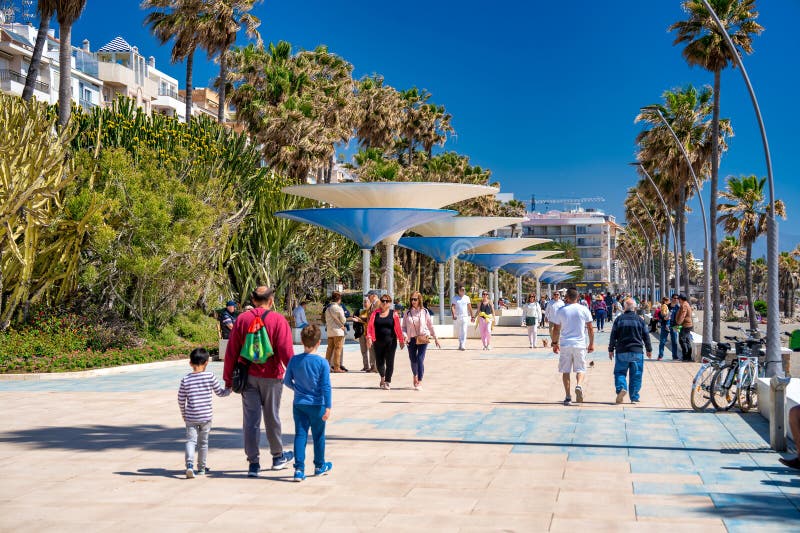Estepona, Spain - April 7, 2023: The beautiful promenade of Estepona on a clear sunny day, Andalusia