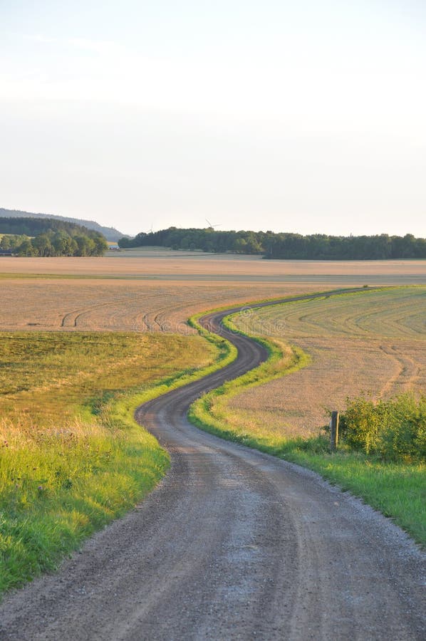 Winding road through rural landscape. Winding road through rural landscape.