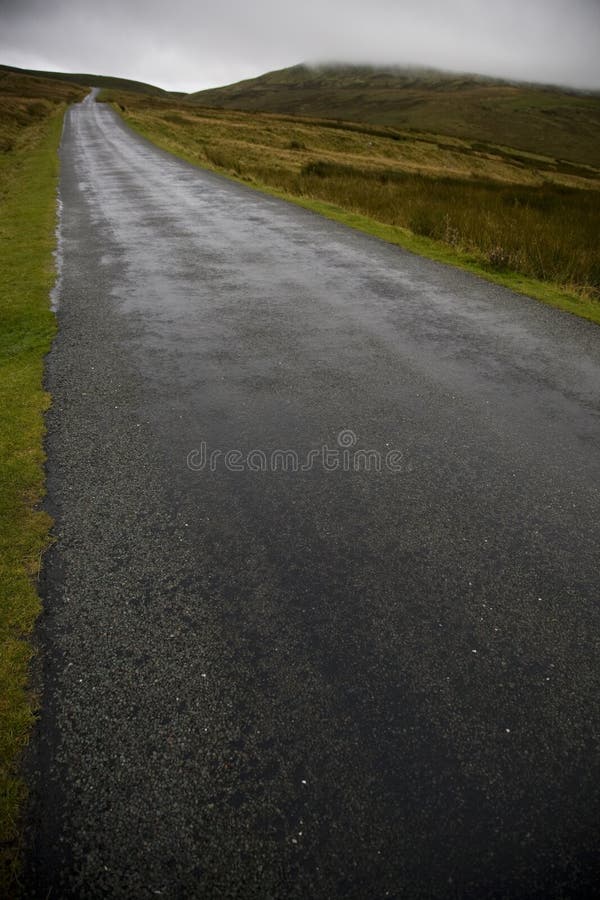 Wet road in Yorkshire Dales Yorkshire England. Wet road in Yorkshire Dales Yorkshire England