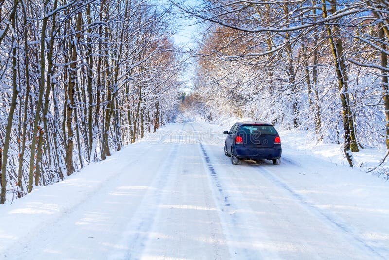 Snowy road in winter forest with single car of Poland. Snowy road in winter forest with single car of Poland