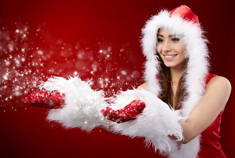 Mulher do Natal a segurar uma estrela fotos de stock