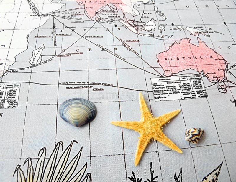 An image of a star fish and seashells taken on an old map of pacific region. Concept picture about travel, sailing, exploration and adventure. Horizontal color photograph, nobody in picture. An image of a star fish and seashells taken on an old map of pacific region. Concept picture about travel, sailing, exploration and adventure. Horizontal color photograph, nobody in picture.