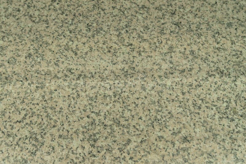 A estrutura do granito cinzento-bege uma pedra natural Worktop industrial do granito no restaurante fotografia de stock royalty free A estrutura do granito cinzento-bege uma pedra natural Worktop industrial do granito no restaurante fotografia de stock royalty free
