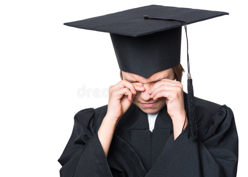 Sad crying disappointed graduate little girl student in a black graduation gown with hat - isolated on white. Negative human emotion facial expression. Child back to school, educational concept. Sad crying disappointed graduate little girl student in a black graduation gown with hat - isolated on white. Negative human emotion facial expression. Child back to school, educational concept.