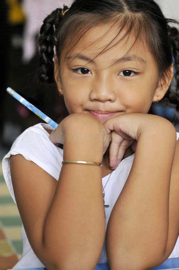 Jovem estudante com um sorriso fotografia de stock