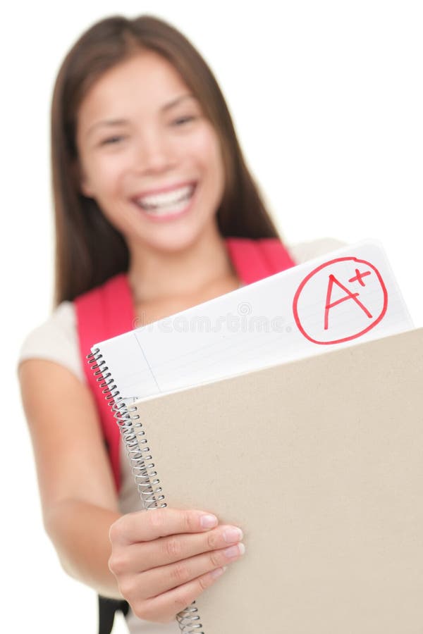 Grade / test results. Female student showing perfect grade A plus. Isolated on white background, focus on grades. Grade / test results. Female student showing perfect grade A plus. Isolated on white background, focus on grades.