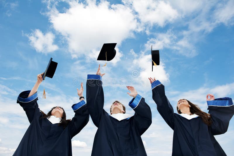 Three graduate students tossing up hats over blue sky. Three graduate students tossing up hats over blue sky