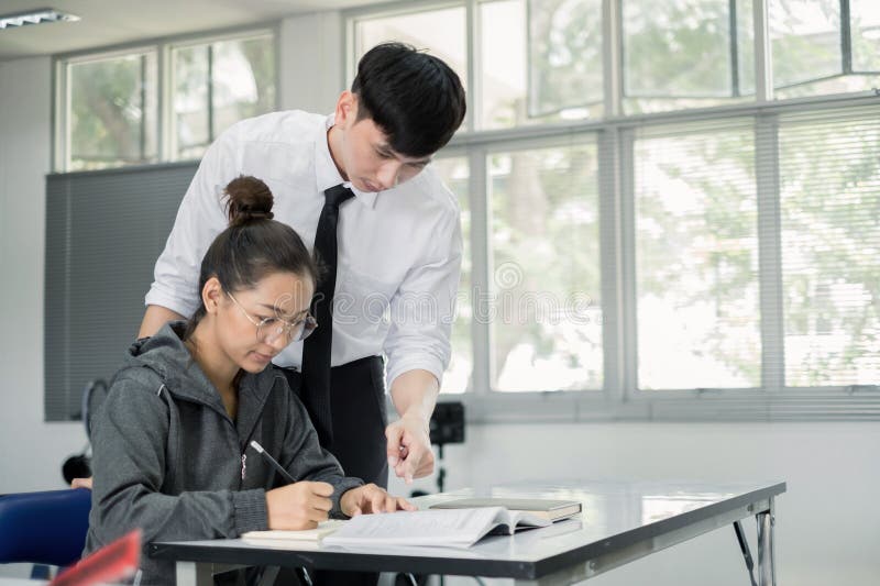 University students study hard and listen to teachers for their lessons with special lectures in the columns of math class. University students study hard and listen to teachers for their lessons with special lectures in the columns of math class.