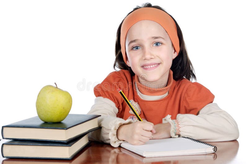 Menina adorável a estudar fotos de stock