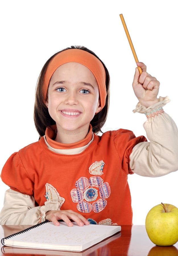 Menina adorável a estudar fotografia de stock royalty free