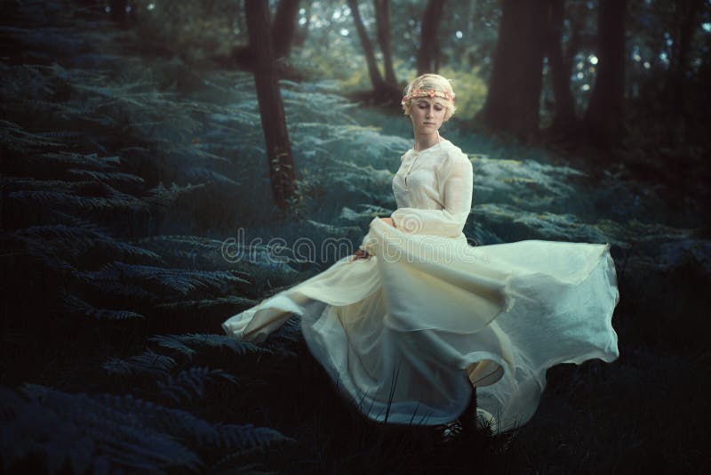 Ethereal woman dancing in dreamy forest stock image Ethereal woman dancing in dreamy forest stock image