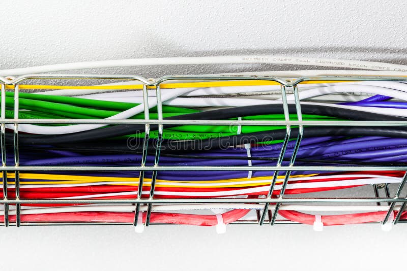 Ethernet cables in a cable guard leading along the ceiling insid royalty free stock image