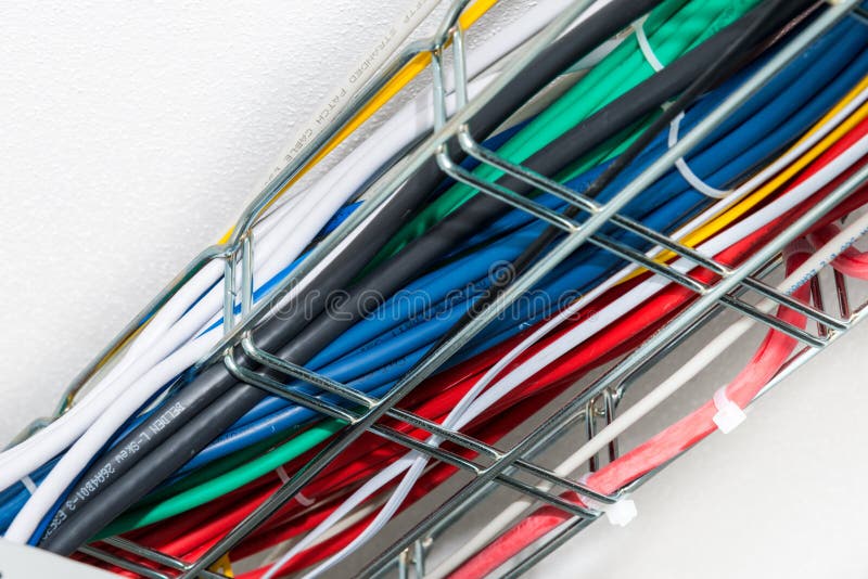 Ethernet cables in a cable guard leading along the ceiling insid royalty free stock photo