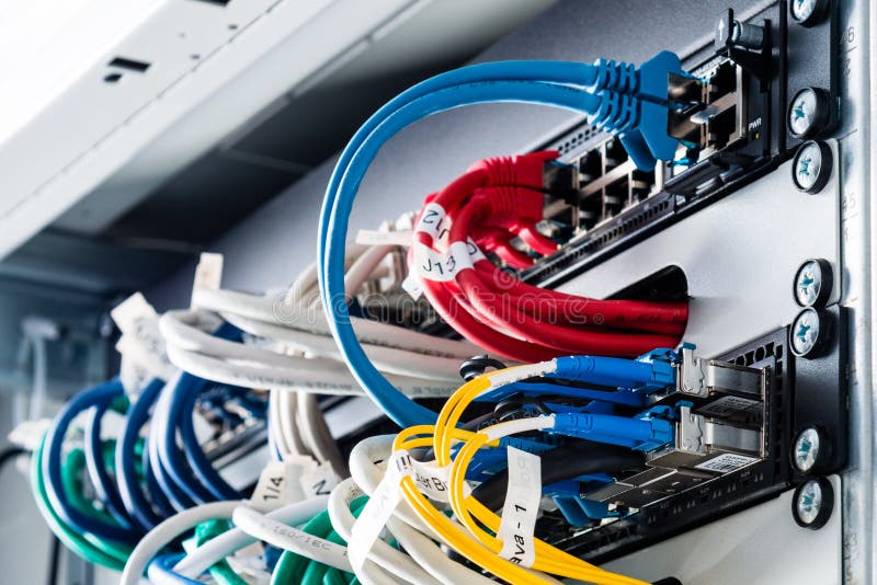 Ethernet cables connected to server switch stock photography