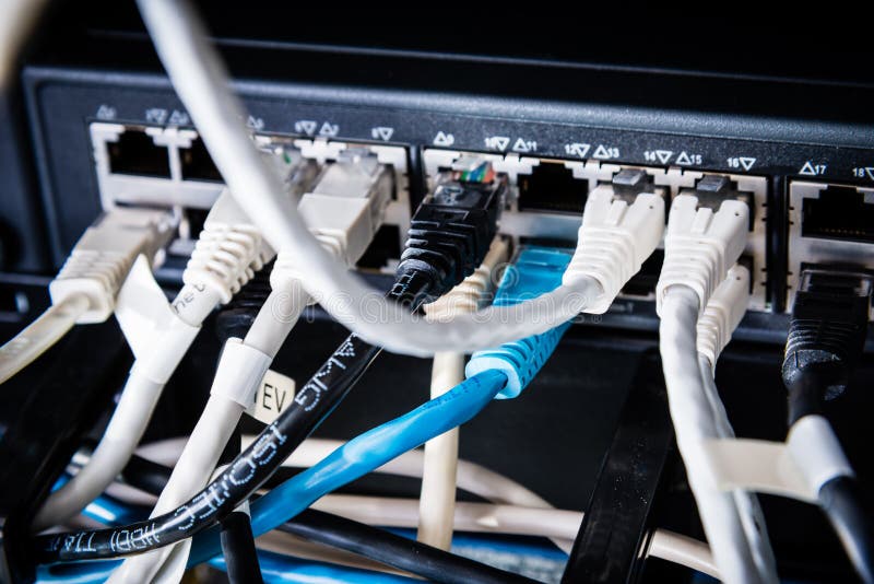 Ethernet cables connected to server switch stock image