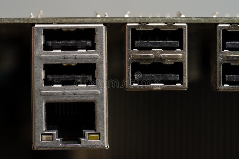 Ethernet port and four USB 2.0 connections on a computer motherboard..