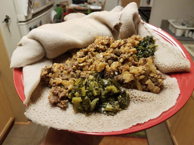 Ethiopian Food Beef and Bread and Spicy Green Pepper Sauce on Red Plate