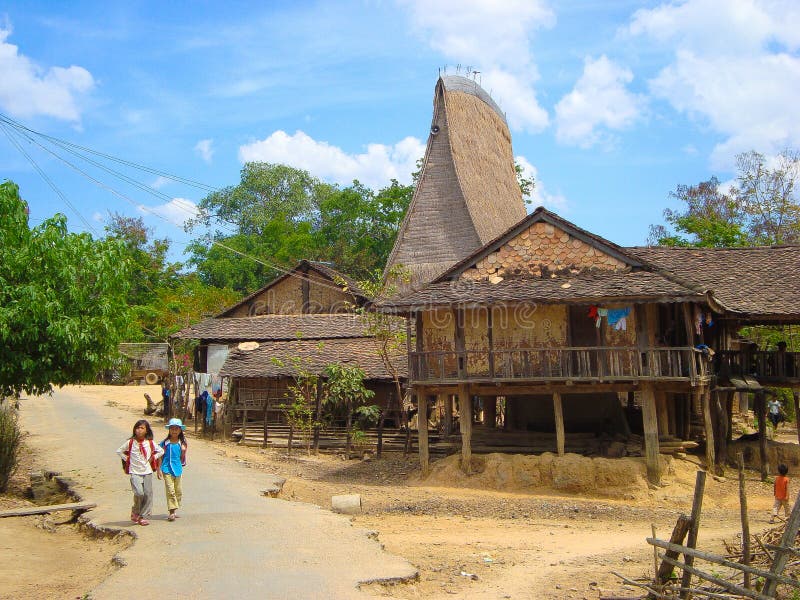 Ethnic Bahnar girl students in traditional community - Vietnam