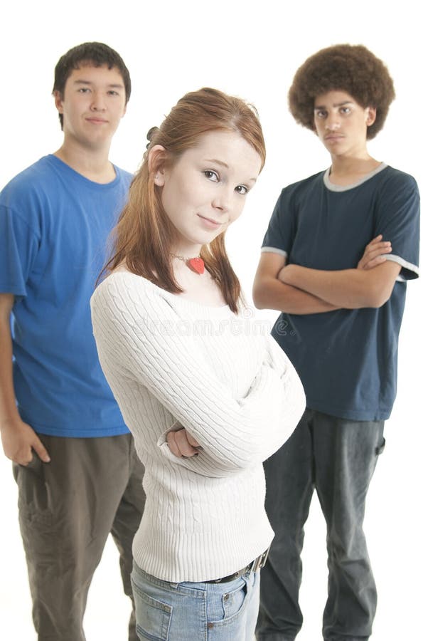 Three teens of different ethnic backgrounds. Focus on Caucasian girl in front. Three teens of different ethnic backgrounds. Focus on Caucasian girl in front