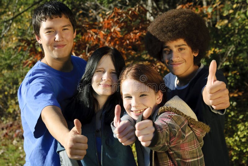 Ethnic teen thumbs up stock images
