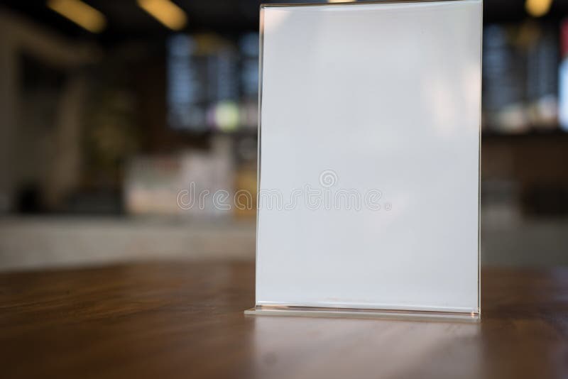 white label in cafe. display stand for acrylic tent card in coffee shop. mockup menu frame on table in bar restaurant. space for text. white label in cafe. display stand for acrylic tent card in coffee shop. mockup menu frame on table in bar restaurant. space for text