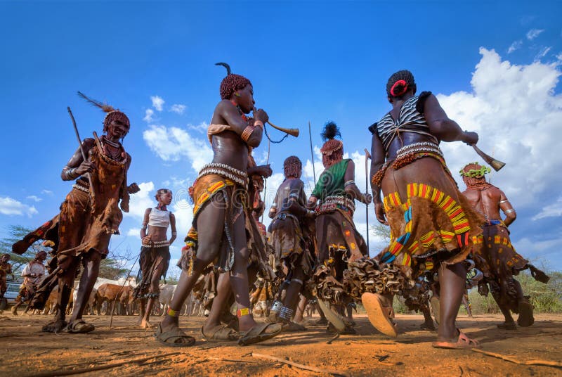 Ethiopia, Turmi village, Omo valley, 16.09.2013, Dancing Hamer tribe in a ceremony of initiation of young men. Ethiopia, Turmi village, Omo valley, 16.09.2013, Dancing Hamer tribe in a ceremony of initiation of young men