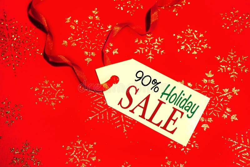 Label with the text - Holiday sale with a 90 percent discount, on a decorated Christmas background, during the Christmas and New Year holidays. Label with the text - Holiday sale with a 90 percent discount, on a decorated Christmas background, during the Christmas and New Year holidays.