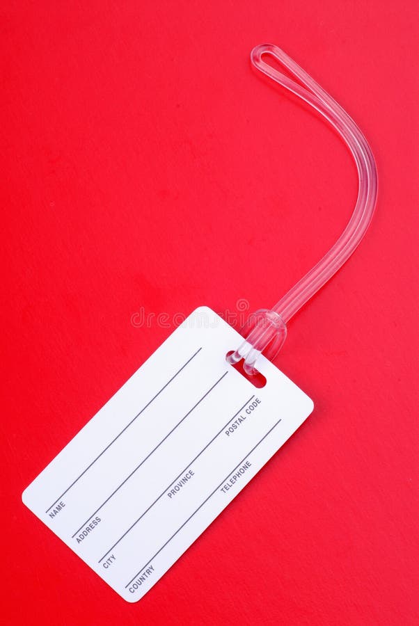 Blank Luggage Label For Your Address To Identify Your Luggage, On A Red Background. Blank Luggage Label For Your Address To Identify Your Luggage, On A Red Background