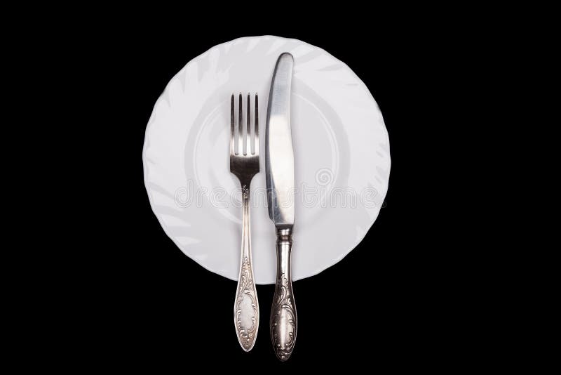 Etiquette Sign. Plate, Fork, Knife Top View Isolated on Black Stock