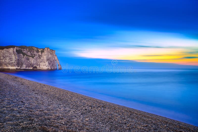 Etretat Aval cliff landmark and its beach Twilight photography. Normandy, France, Europe. Long exposure. Etretat Aval cliff landmark and its beach Twilight photography. Normandy, France, Europe. Long exposure.