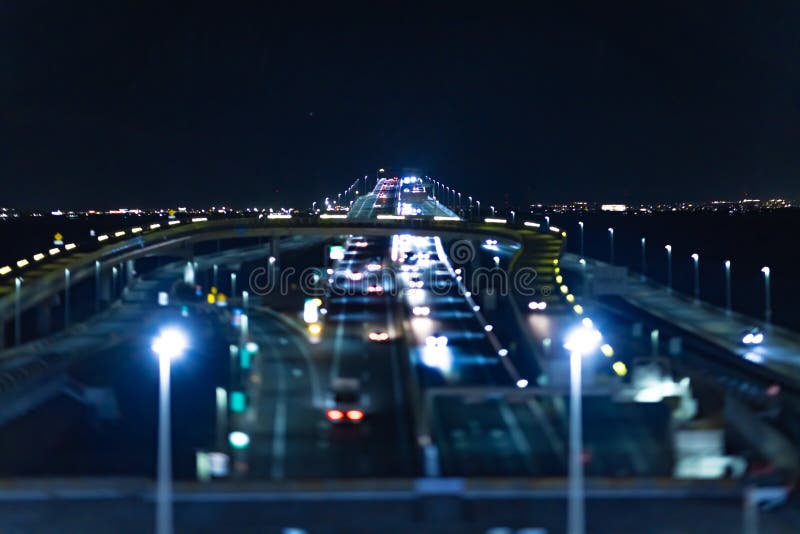 A night miniature traffic jam on the highway at Tokyo bay area. High quality photo. Kisarazu district Chiba Japan 01.30.2024 Here is the highway parking called UMIHOTARU PA in Chiba Japan. A night miniature traffic jam on the highway at Tokyo bay area. High quality photo. Kisarazu district Chiba Japan 01.30.2024 Here is the highway parking called UMIHOTARU PA in Chiba Japan.