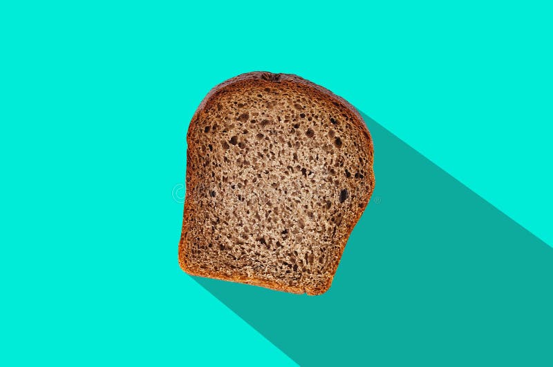 Ett rektangelstycke av nytt rågbröd i mitt av den gröna tabellen på kök med lång hård skugga Top beskådar royaltyfria foton Ett rektangelstycke av nytt rågbröd i mitt av den gröna tabellen på kök med lång hård skugga Top beskådar royaltyfria foton