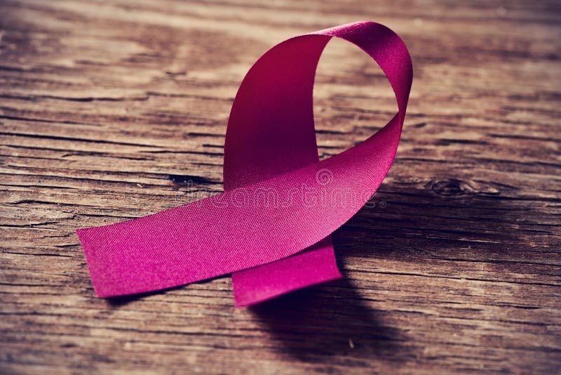 Ett rosa band, symbol av bröstcancermedvetenhet