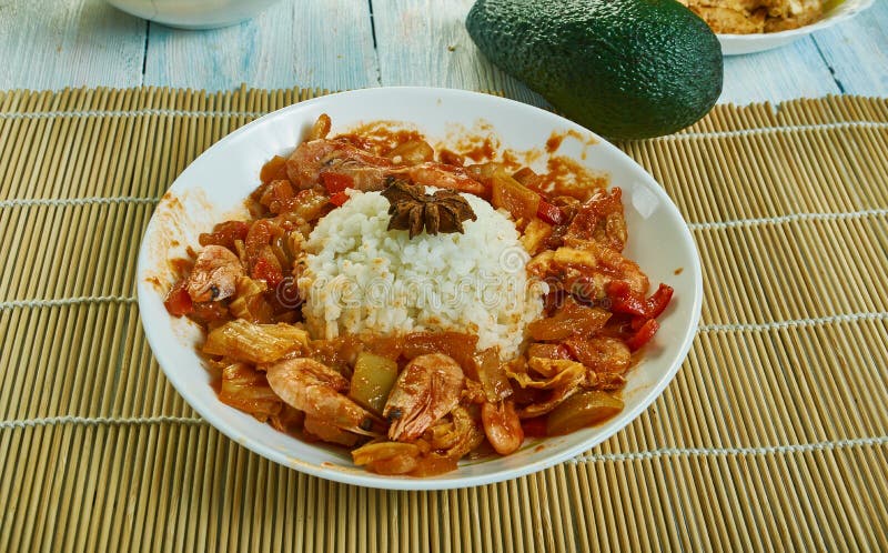 Etouffee  dish found in both Cajun and Creole cuisine typically served with shellfish over rice. Etouffee  dish found in both Cajun and Creole cuisine typically served with shellfish over rice