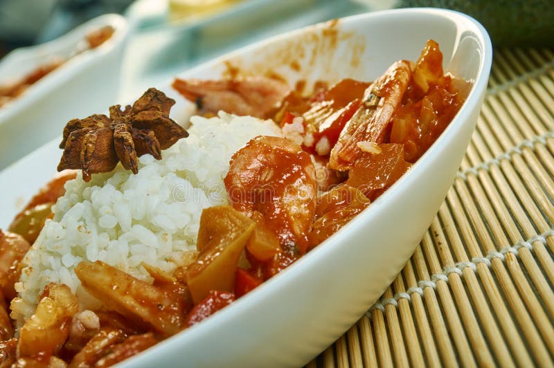 Etouffee  dish found in both Cajun and Creole cuisine typically served with shellfish over rice. Etouffee  dish found in both Cajun and Creole cuisine typically served with shellfish over rice