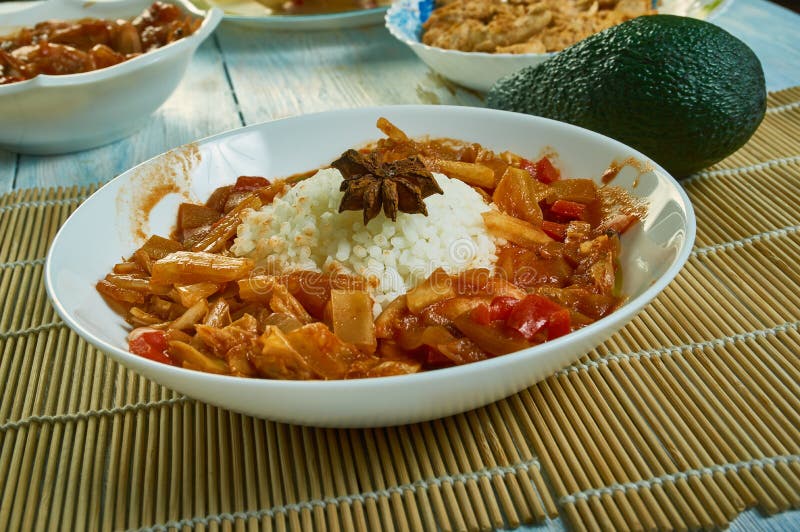Etouffee  dish found in both Cajun and Creole cuisine typically served with shellfish over rice. Etouffee  dish found in both Cajun and Creole cuisine typically served with shellfish over rice