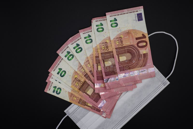 10 euro banknotes on surgical mask on black background. Coronavirus economic crisis concept royalty free stock photos 10 euro banknotes on surgical mask on black background. Coronavirus economic crisis concept royalty free stock photos