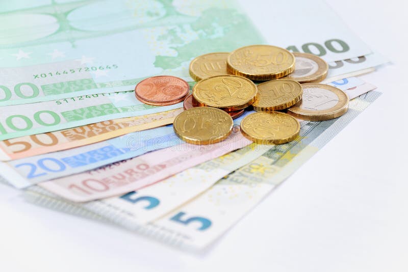 Euro bills and Coins with a white background